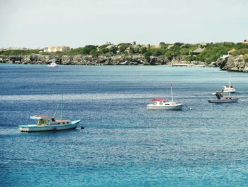 Boats sailing in sea