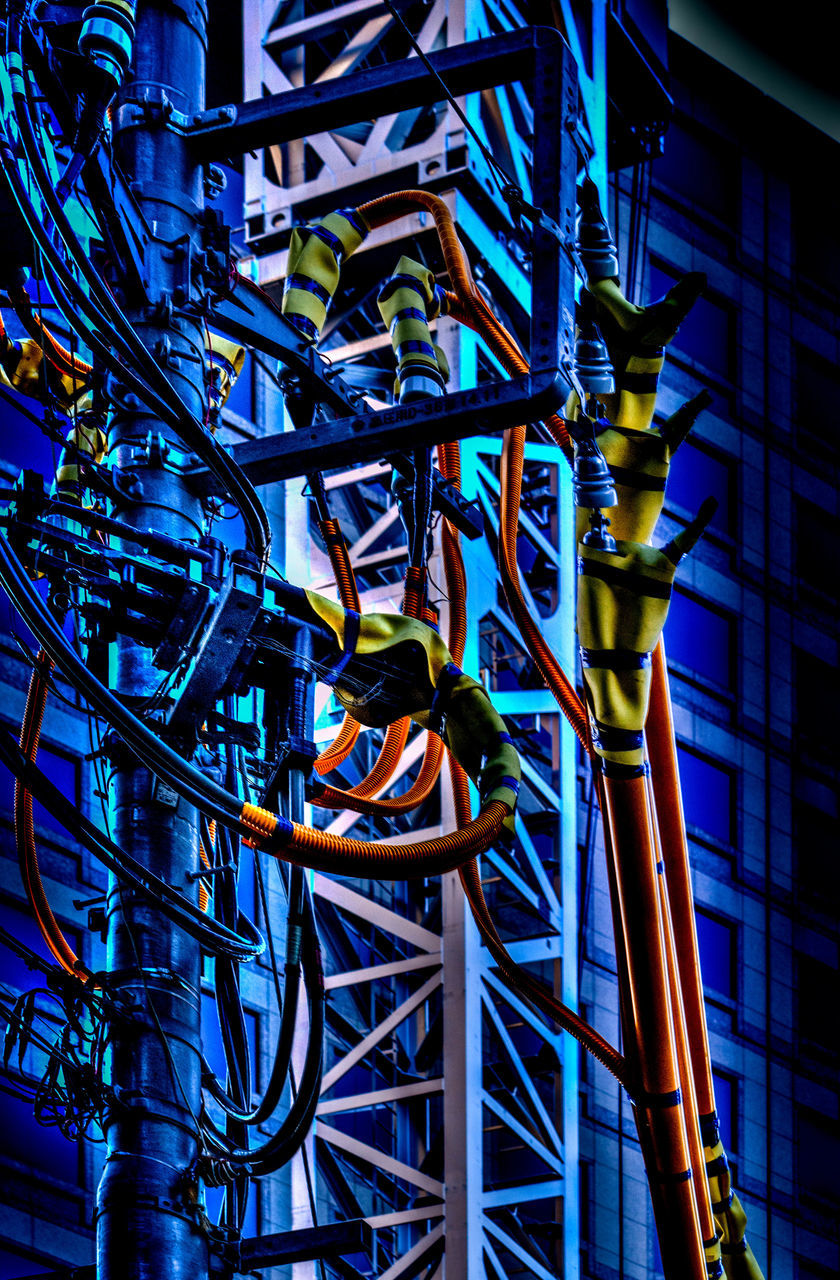 LOW ANGLE VIEW OF CABLES AGAINST BLUE SKY