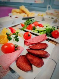 Close-up of chopped fruits in plate on table