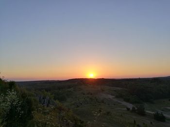 Scenic view of landscape at sunset