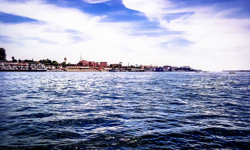 Scenic view of sea against blue sky