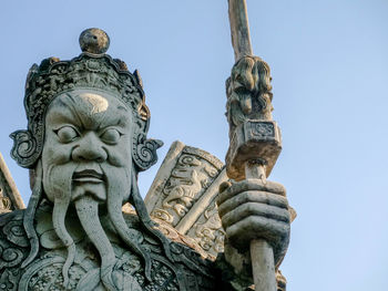 Low angle view of statue against clear sky