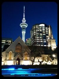 Low angle view of illuminated building at night