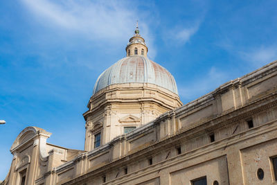 Low angle view of historical building against cloudy sky