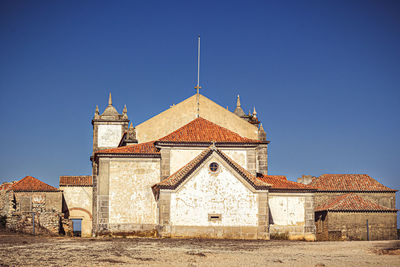 Old building against clear blue sky