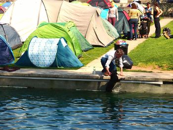 People working in lake