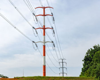 Electric poles with wires against the sky, power line.