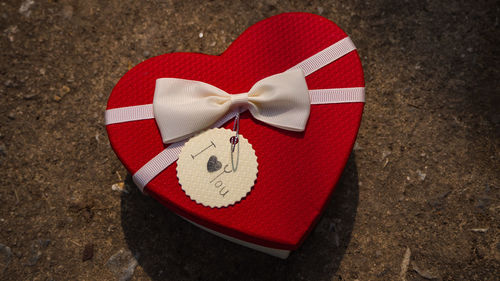 Close-up of heart shape on sand