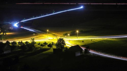Vehicles on road at night