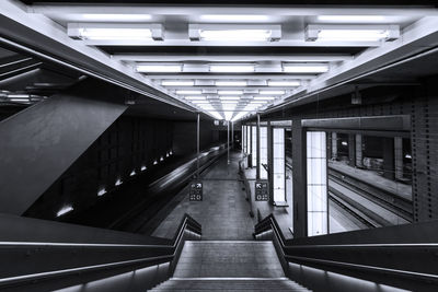 Interior of illuminated railroad station platform