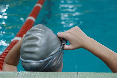 Low section of woman swimming in pool