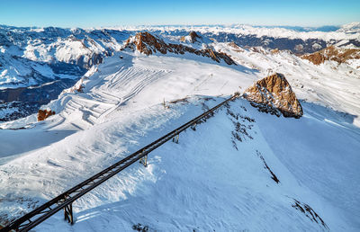 Panoramic view of ski lift of sunny alp mountains of winter austria