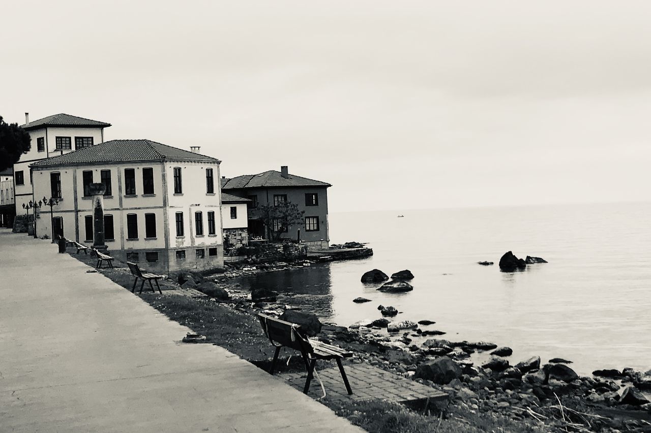 water, built structure, sky, architecture, building exterior, building, sea, copy space, nature, no people, day, residential district, clear sky, house, outdoors, beauty in nature, tranquility, tranquil scene, scenics - nature, wooden post