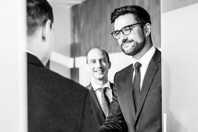 Portrait of businessman using mobile phone