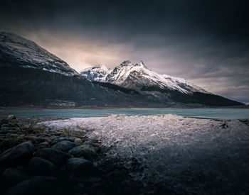 Scenic view of snowcapped mountains against sky during winter