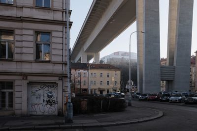 Street amidst buildings in city against sky