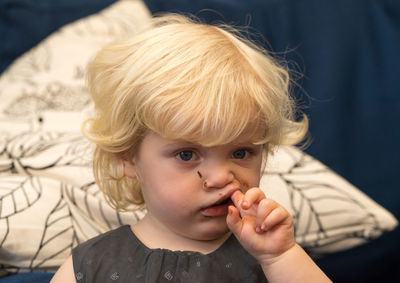 Portrait of cute baby girl with chocolate on face