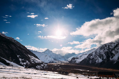 Scenic view of snowcapped mountains against sky