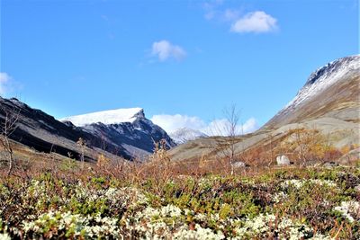 Scenic view of snowcapped mountains against sky