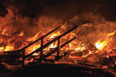 Low angle view of bonfire on fire at night