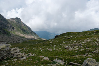 Scenic view of mountains against cloudy sky