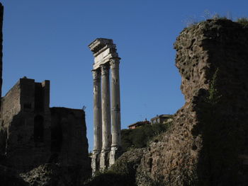 Low angle view of old ruins against sky