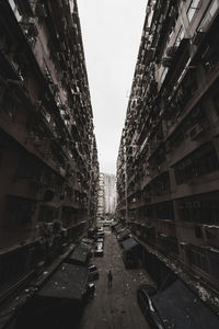 Street amidst buildings against sky