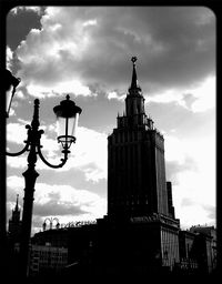 Low angle view of building against cloudy sky