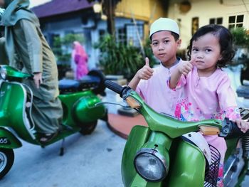 Portrait of mother and girl riding