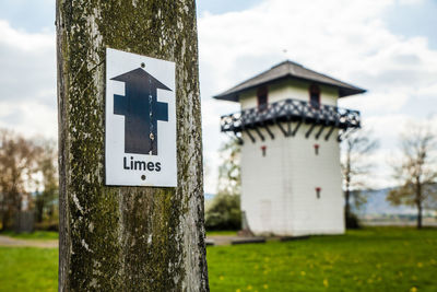 Close-up of sign against sky at old limes tower in germany 