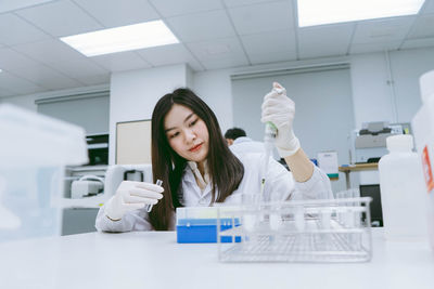 Scientist holding test tube at laboratory