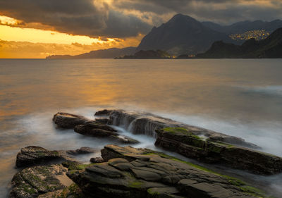 Scenic view of sea against cloudy sky