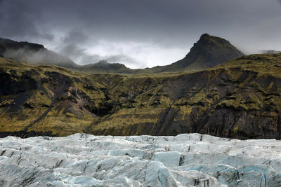 Scenic view of glacier on landscape against sky