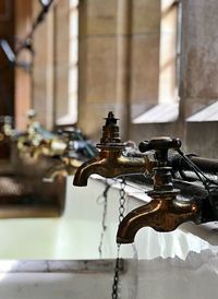 Close-up of faucet in bathroom