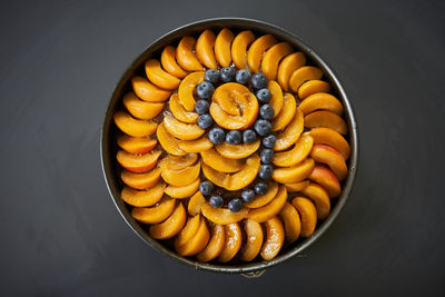 Directly above shot of cake on table against black background