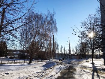 Snow covered field against sky