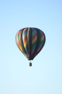 Low angle view of hot air balloon against clear sky