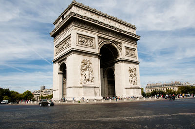 View of triumphal arch against cloudy sky