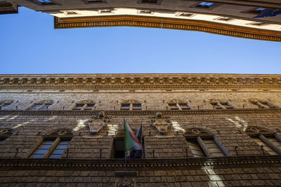 Low angle view of historical building against clear sky