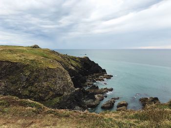 Scenic view of sea against cloudy sky