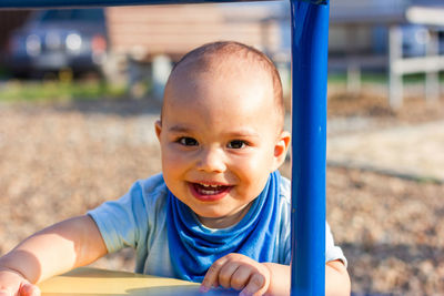 Portrait of cute boy playing outdoors
