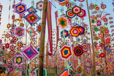 Low angle view of multi colored decoration hanging on wall