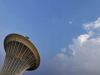 Low angle view of building against cloudy sky