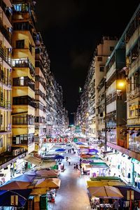 High angle view of city street and buildings at night