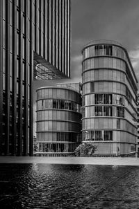 Low angle view of modern buildings against sky in city