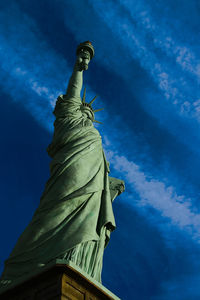 Low angle view of statue against blue sky