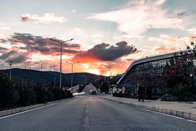 Street against sky during sunset