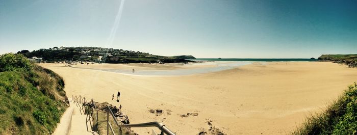 Panoramic view of beach against clear sky