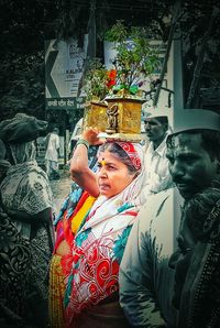 Young woman in traditional clothing flower