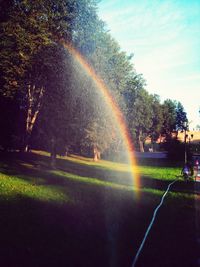 Scenic view of rainbow over landscape